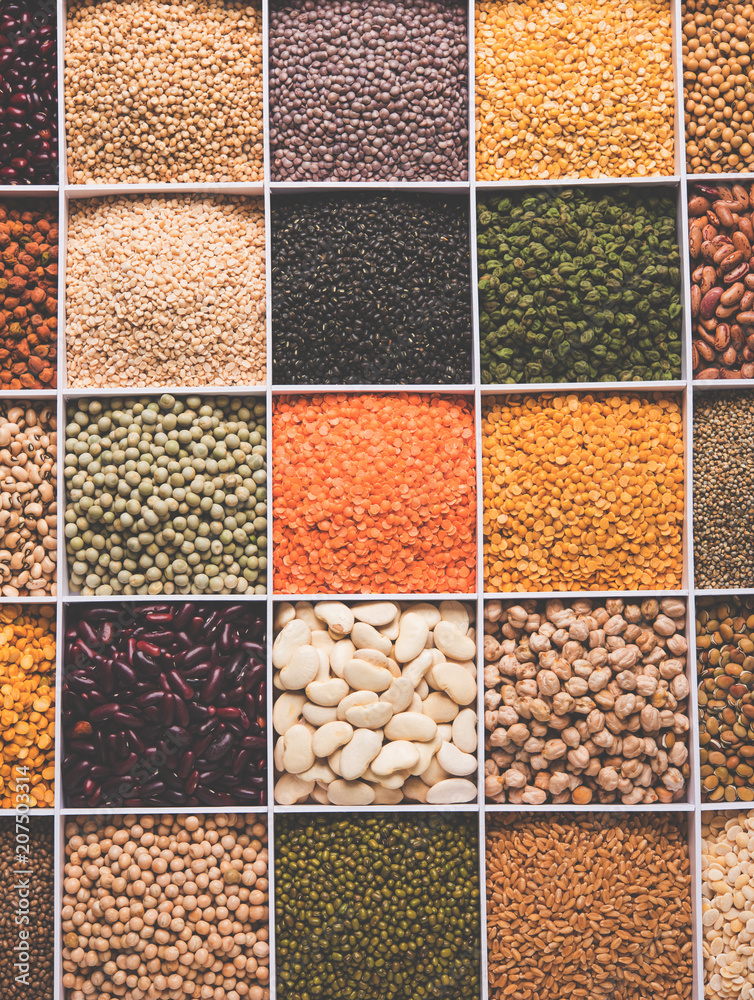Indian Beans,Pulses,Lentils,Rice and Wheat grain in a white wooden box with cells, selective focus. Indian Beans,Pulses,Lentils,Rice and Wheat grain in a white wooden box with cells, selective focus.