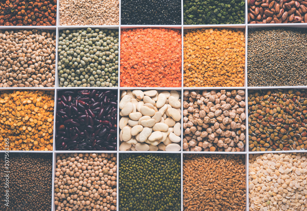 Indian Beans,Pulses,Lentils,Rice and Wheat grain in a white wooden box with cells, selective focus. Indian Beans,Pulses,Lentils,Rice and Wheat grain in a white wooden box with cells, selective focus.