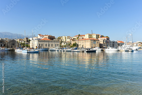 View of the Venetian port of Chania with the center of mediterranean architecture, ships and pleasure boats © ksl