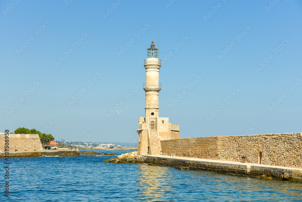 Lighthouse in the historical venetian port of Chania. The greek city on the north coast of Crete is one of the most beautiful towns on the island	