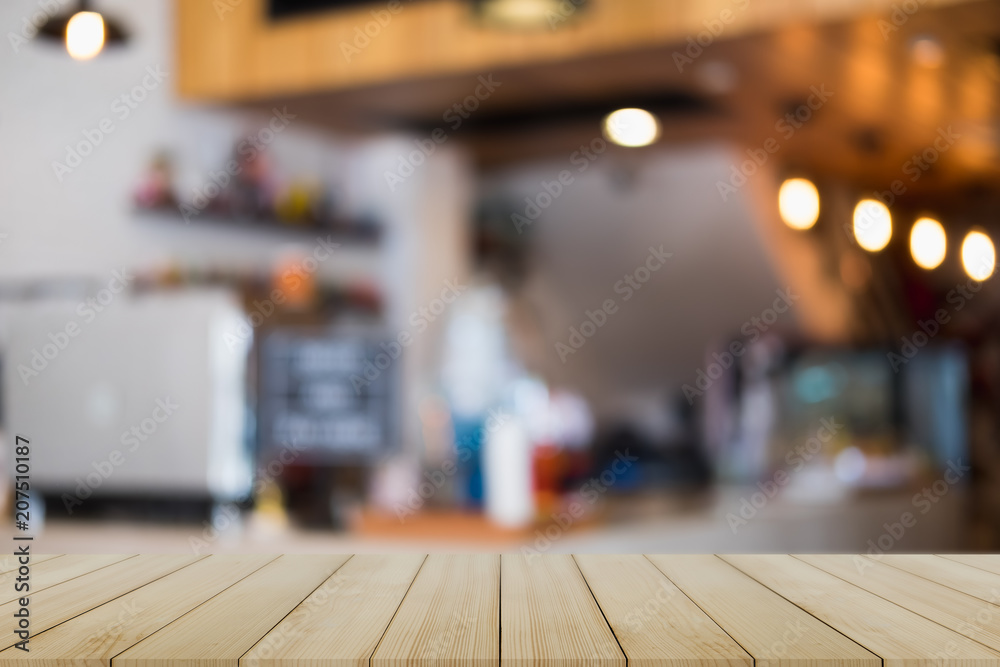 Empty wooden table and blurred cafe background, can be used for display or montage your products Empty wooden table and blurred cafe background, can be used for display or montage your products