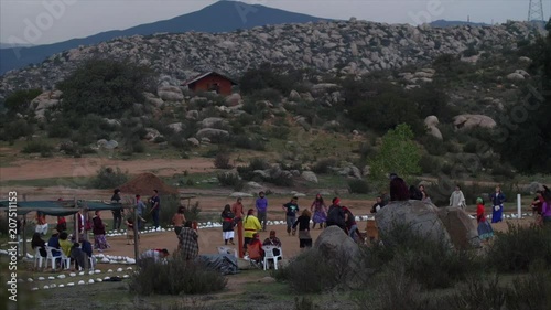 Native American Indians dance in ceremony, on sacred land, for the changes in season.