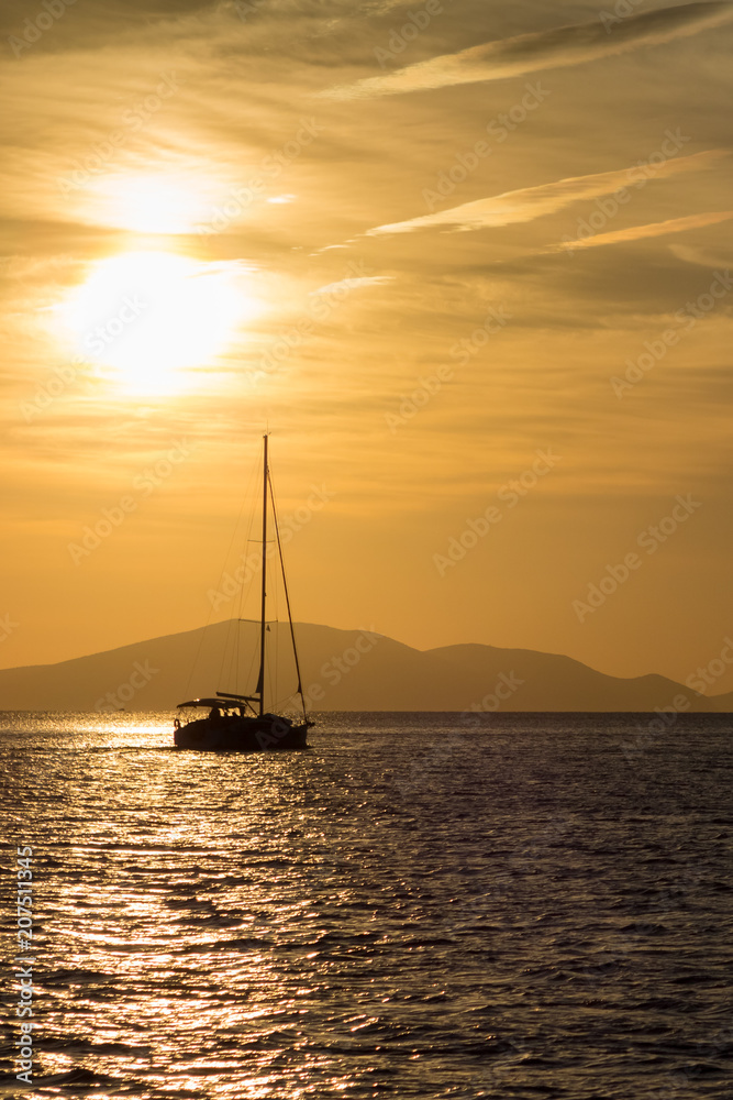 Boat and Greek Island at sun set