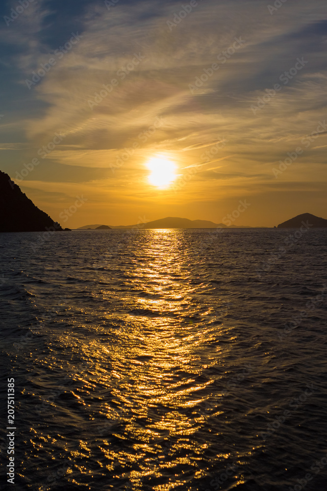 The sun sets over the Aegean Sea