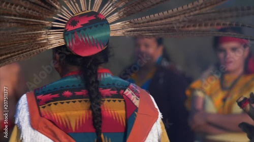 Native American Indians dance in ceremony, on sacred land, for the changes in season.
