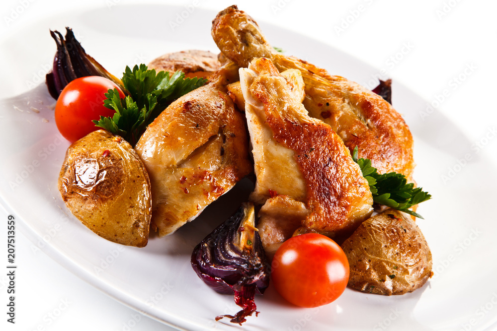 Grilled drumsticks with baked potatoes white background Grilled drumsticks with baked potatoes white background