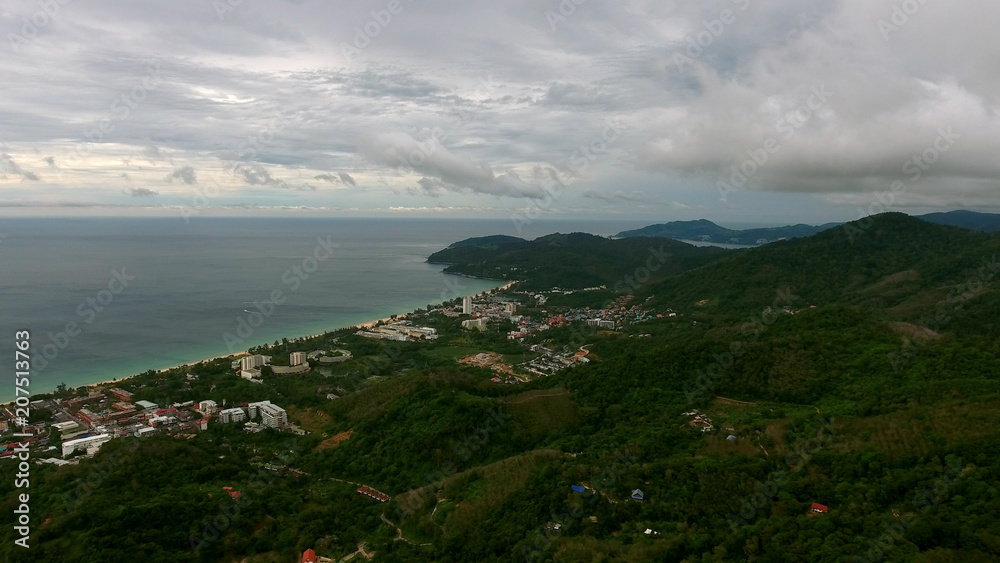 Flying over city near the beach in Phuket Flying over city near the beach in Phuket