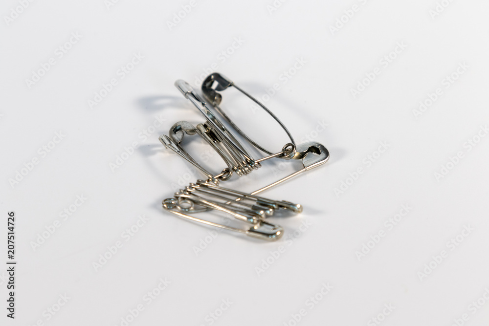 Bunch of nappy pins isolated on white background Bunch of nappy pins isolated on white background