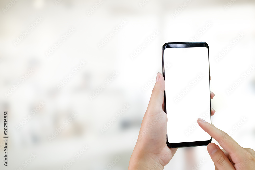 Hands using smartphone mockup is empty screen and blur background. Hands using smartphone mockup is empty screen and blur background.