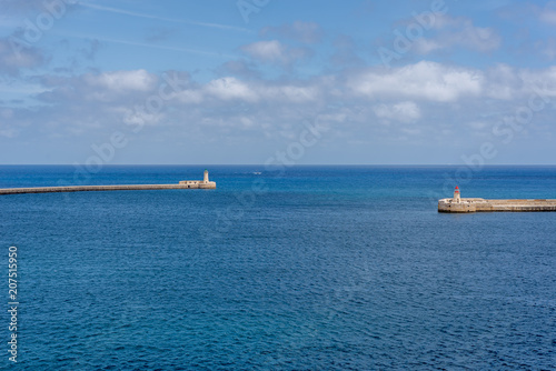 Photo of Mediterranean Sea, view from Valletta, Malta. Blue cloudy sky as background. © michaldziedziak