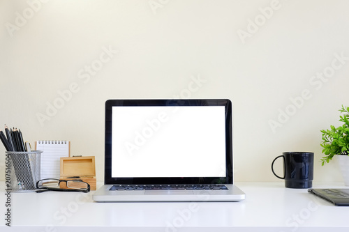 Wallpaper Mural Workspace with laptop computer on white table and yellow background mockup space. Torontodigital.ca