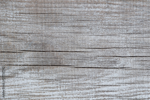 Wooden background with old blue paint and cracks
