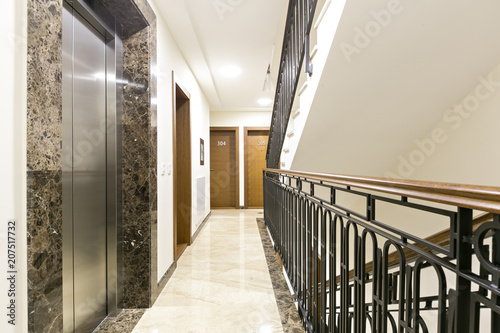 Hotel corridor interior with stairs