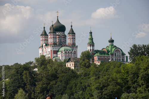 Beautiful building behind the green trees, big church