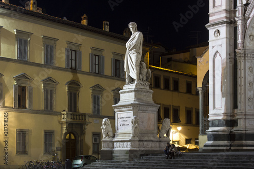 Night view of Dante Alighieri statue in Florence, Italy
