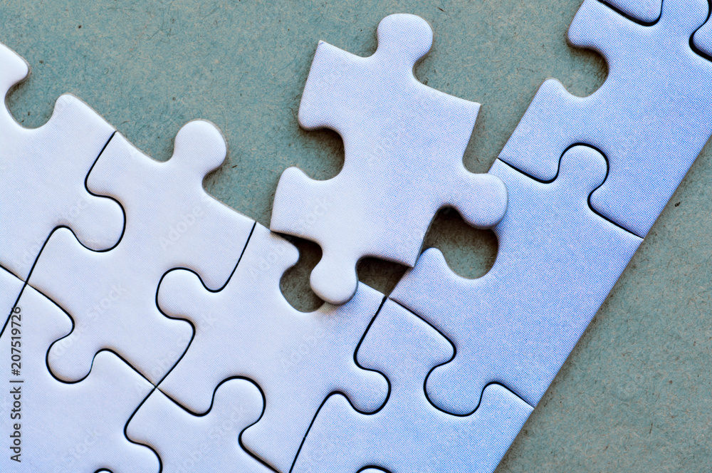 Connected pieces of blue one-color puzzle. Closeup. Connected pieces of blue one-color puzzle. Closeup.