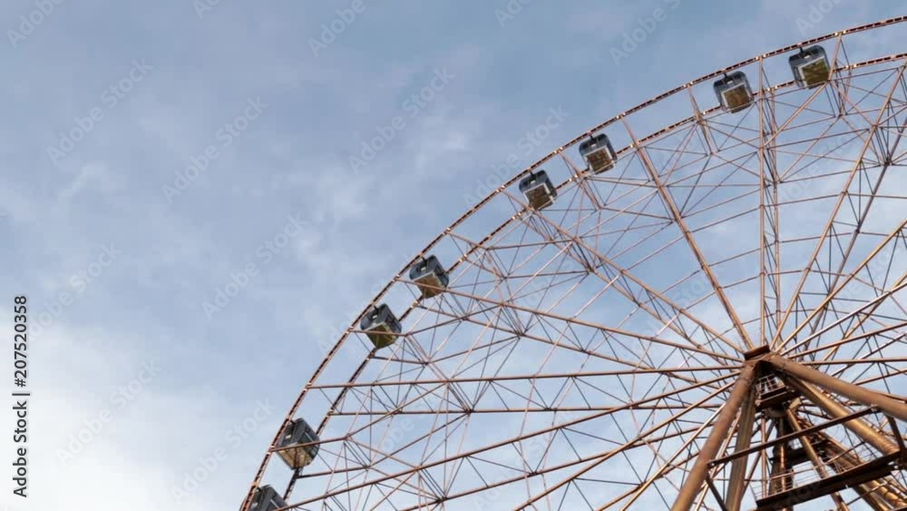 Amusement park. Attraction of the Ferris wheel. Amusement park. Attraction of the Ferris wheel.