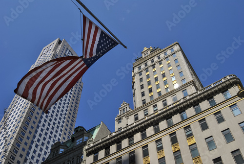 View of an American Flag and the tall skyscrapers in Manhattan, New York City, USA
