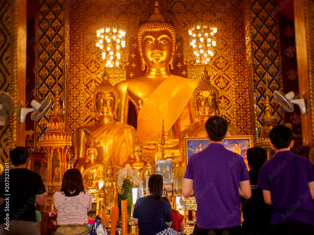 LAMPHUN,THAILAND-CIRCA MAY 2018 Golden biggest principle Buddha image in Hariphunchai temple with many tourist and people coming here everyday at Lamphun, Thailand