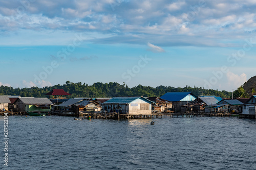 houses on stilts in Yellu village at sunset, east Misool, Indonesia