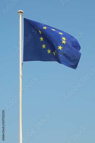 Blue europe european flag floats in the wind