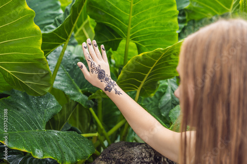 Woman with mahendi. Hand decorated with henna Tattoo. mehendi hand photo