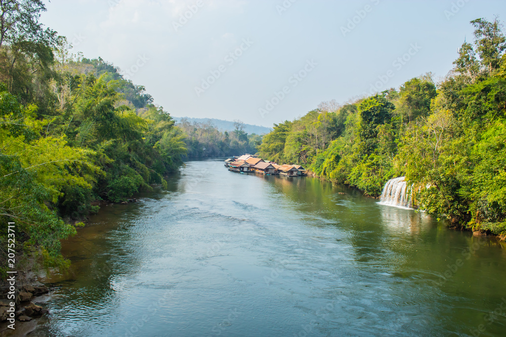 The houseboat and floating restaurant at Sai Yok Yai waterfall , Kanchanaburi in thailand The houseboat and floating restaurant at Sai Yok Yai waterfall , Kanchanaburi in thailand