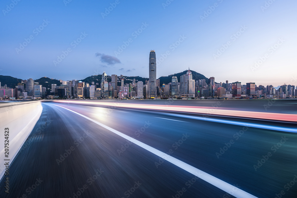 urban road with panoramic city skyline