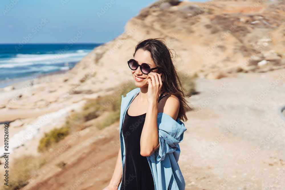 Young beautiful girl looks afar at sea Young beautiful girl looks afar at sea