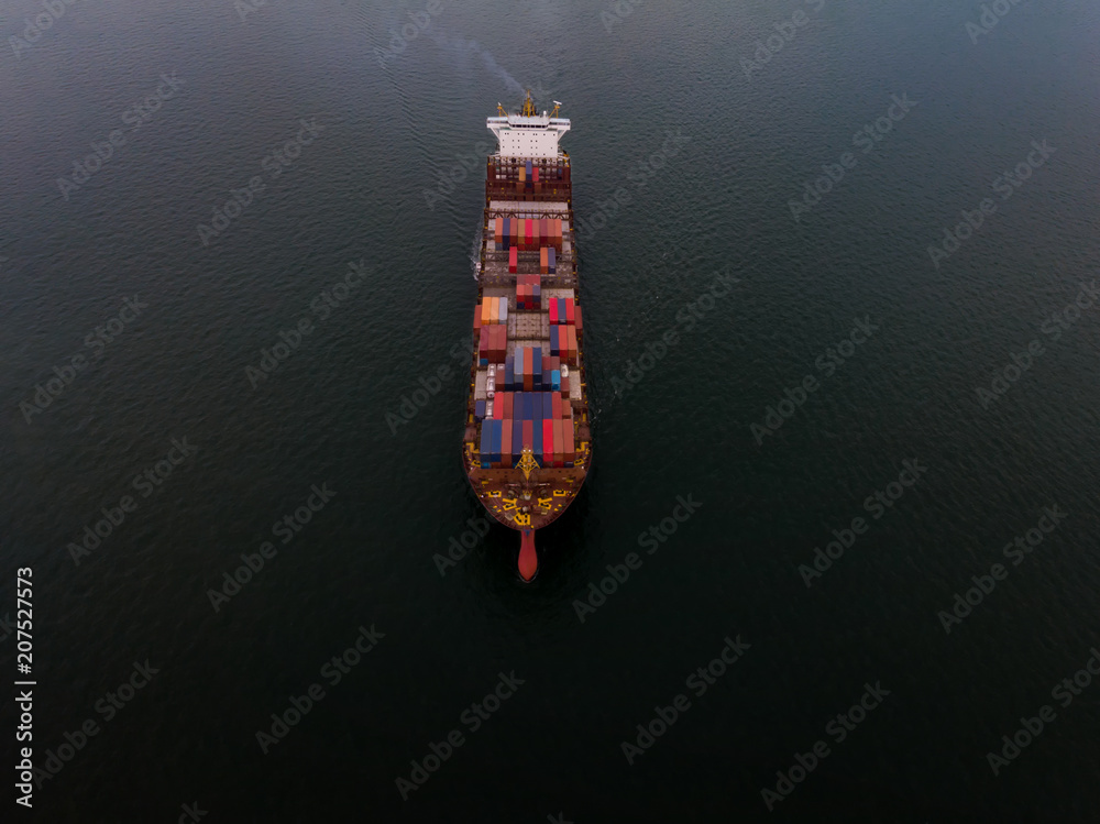 Cargo container ship sailing alone on the black ocean for export freight shipping by ship concept. Cargo container ship sailing alone on the black ocean for export freight shipping by ship concept.