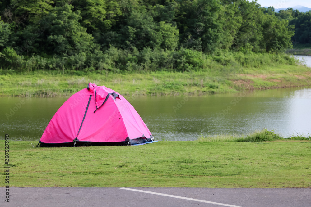 Campsite and tents on the lawn with beautiful green nature landscapes