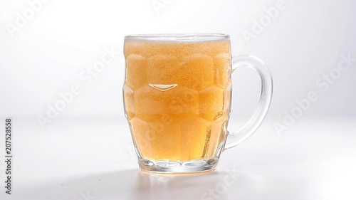 Pouring Glass of light beer photo