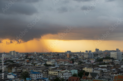 Storm with beautiful sunset in the city. © newroadboy