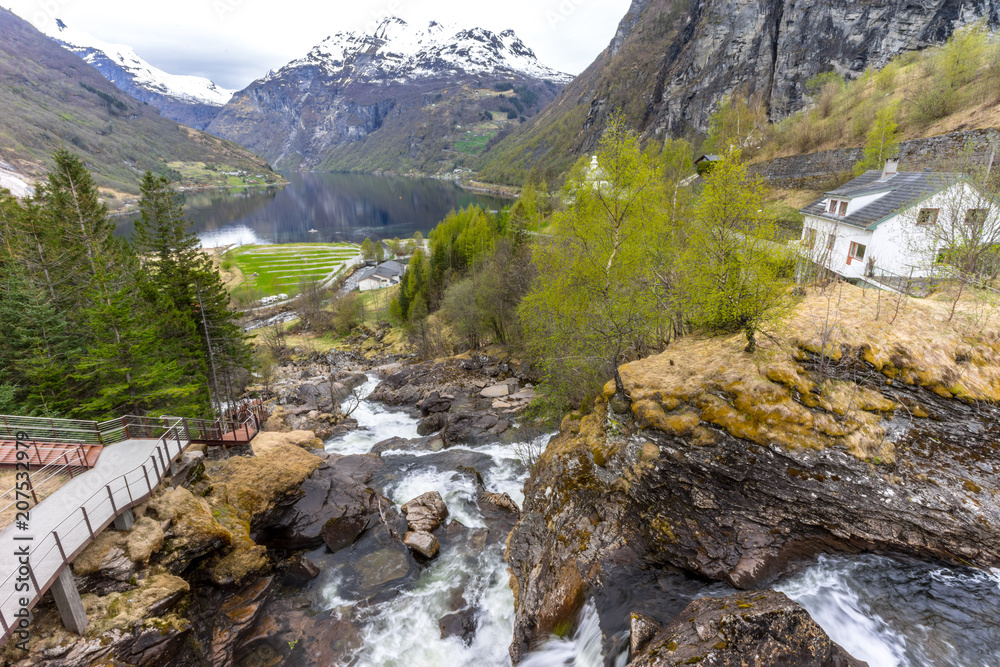 Obraz premium Waterfall walk in Geiranger with Geirangerfjord in the background, Norway