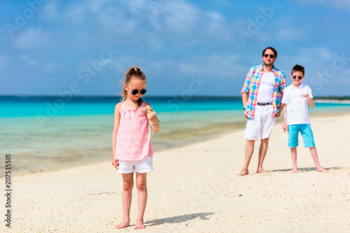 Father with kids at beach