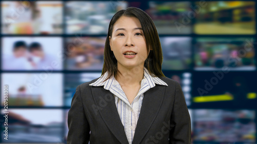 Asian anchorwoman in TV studio