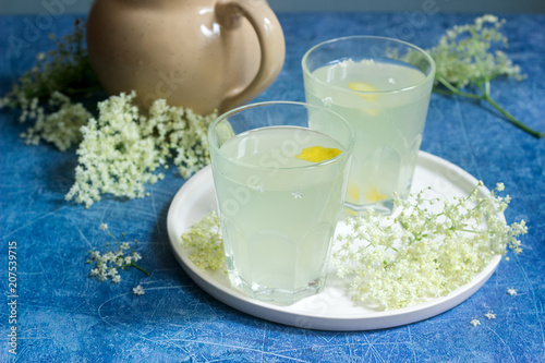 Cold sokata - a traditional Romanian drink made from the flowers of elder and lemon, produced by fermentation. photo
