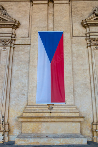National flag of Czech Republic. Placed vertically oriented on the wall