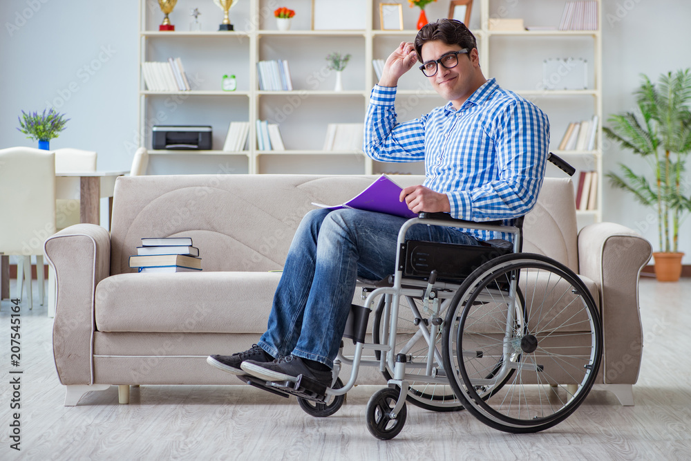 Young student on wheelchair in disability concept Young student on wheelchair in disability concept