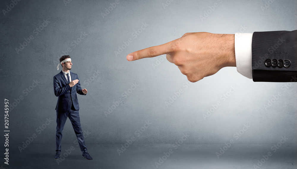 Fototapeta premium Small karate man fighting with big hand
