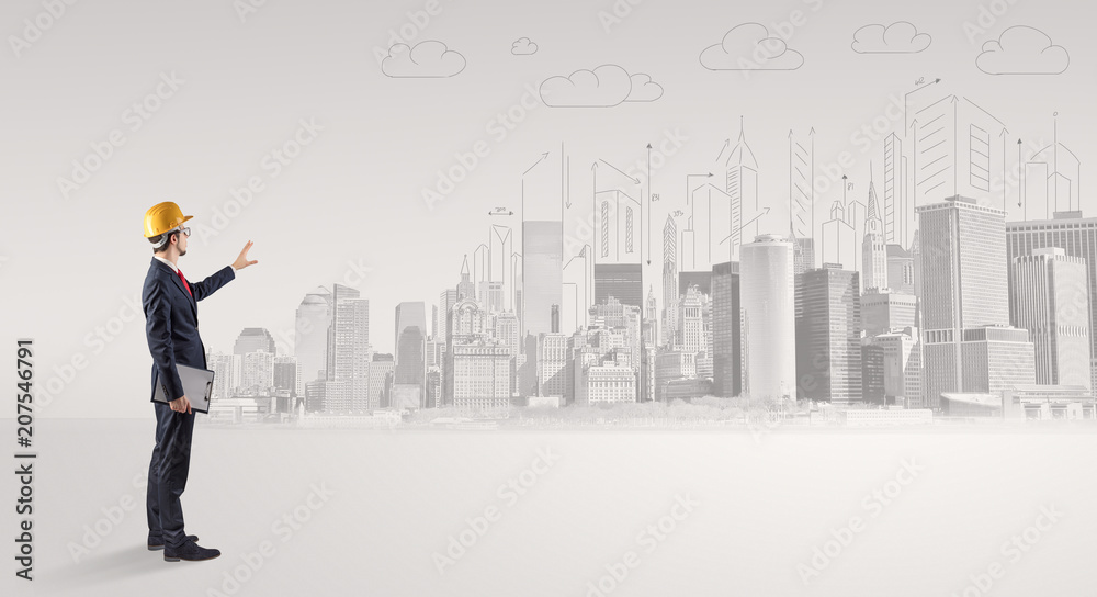 Young supervisor architect standing and replanning a big city panorama
Young supervisor architect standing and replanning a big city panorama