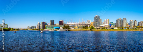 Panorama of the Skyline of the City of Vancouver, British Columbia, Canada as seen from the False Creek Inlet on a clear summer day