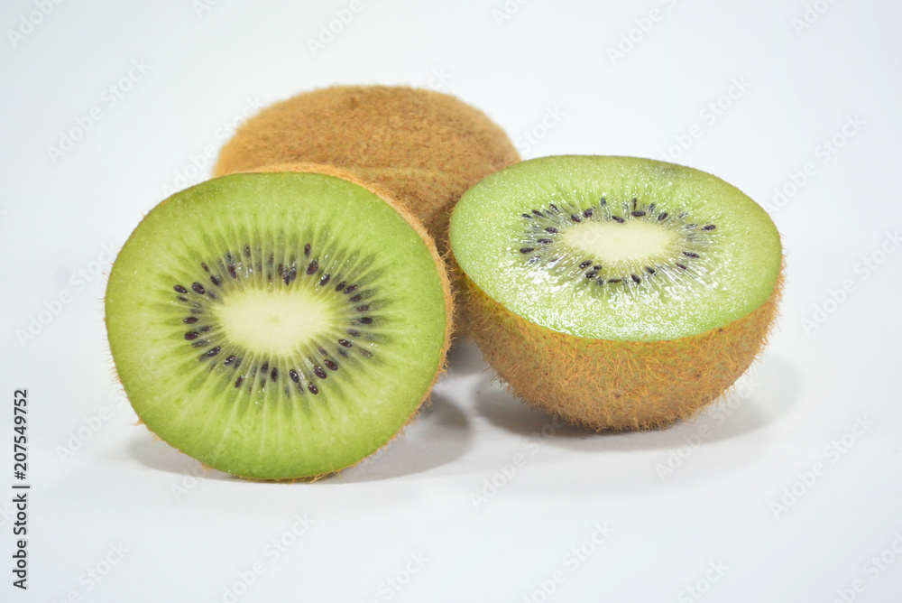 Half spiced kiwi with bright green kiwi isolated on white background Half spiced kiwi with bright green kiwi isolated on white background