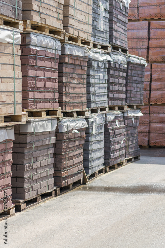 pallets with bricks in the building store. Racks with brick. Masonry, stonework. pallets with bricks in the building store. Racks with brick. Masonry, stonework.