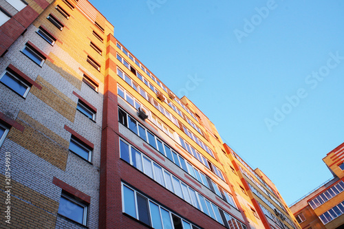 multi-storey brick building, round and rectangular windows