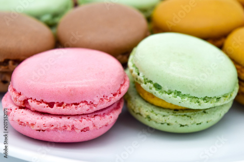 Sweet colorful macarons isolated on white background