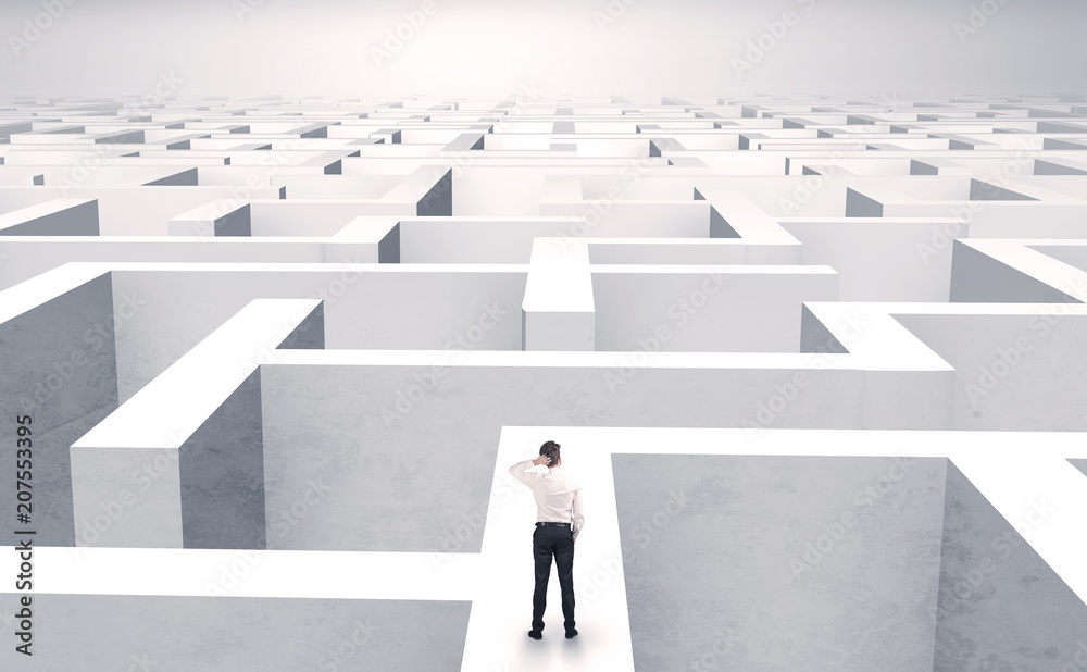 Small businessman in a middle of a huge maze
Small businessman in a middle of a huge maze