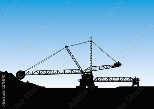 Silhouette of a bucket wheel excavator photo