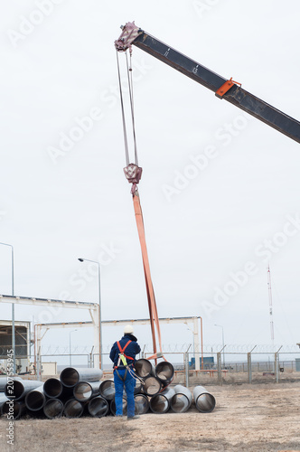 crane works (pipes unloading)