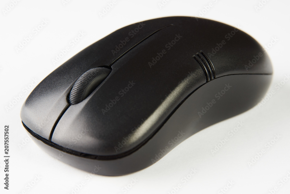 Wireless computer mouse isolated on white background, close-up. Black optical computer mouse. Wireless computer mouse isolated on white background, close-up. Black optical computer mouse.